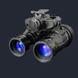 Black night vision device with blue lenses on a reflective surface