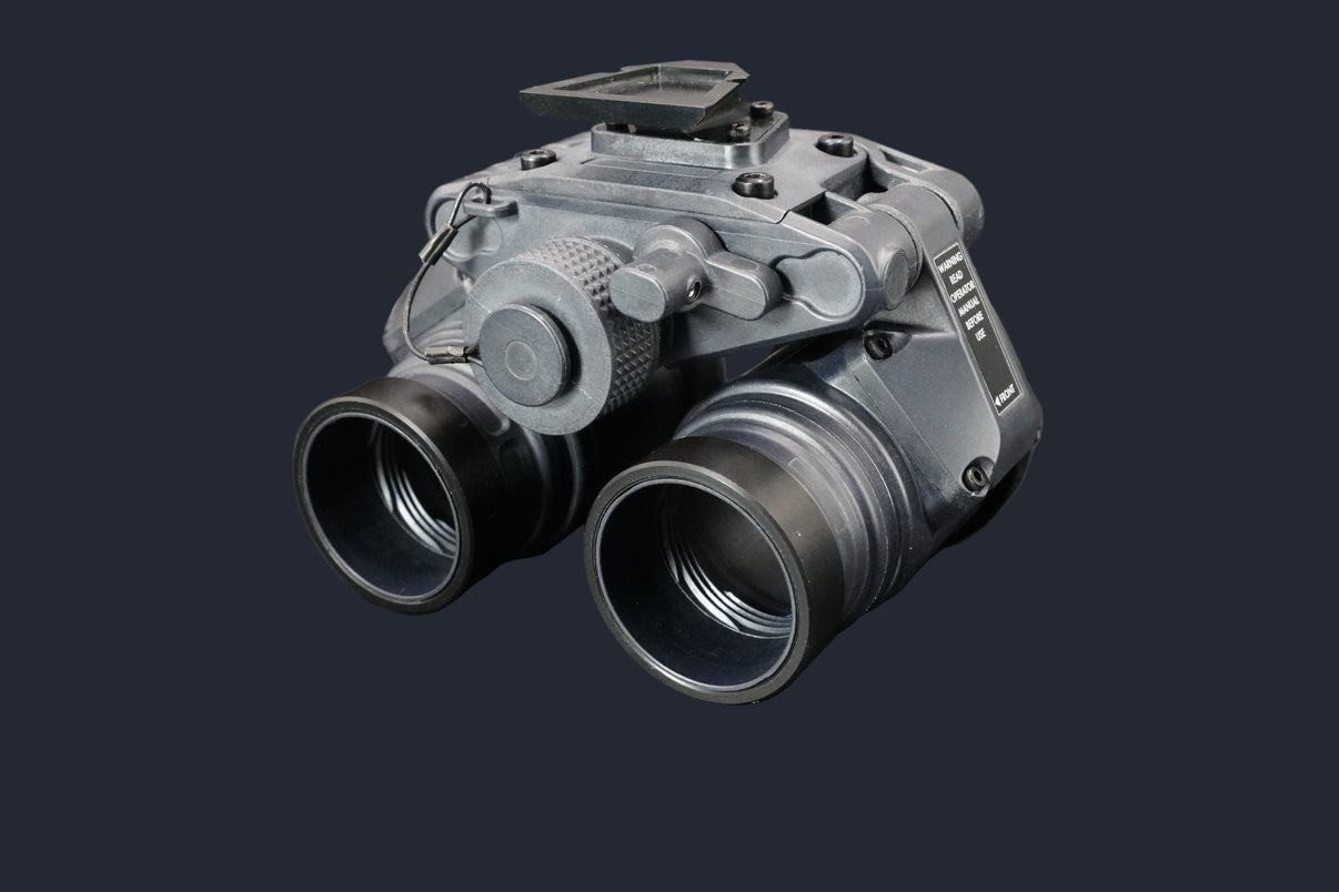 Binoculars with a metallic finish on a dark background