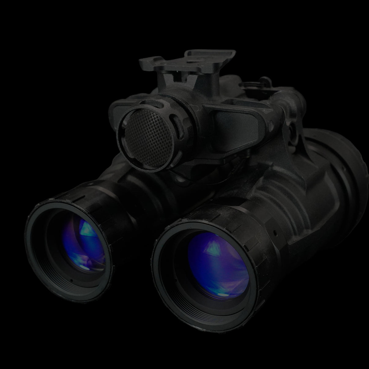 Black night vision goggles on a dark background