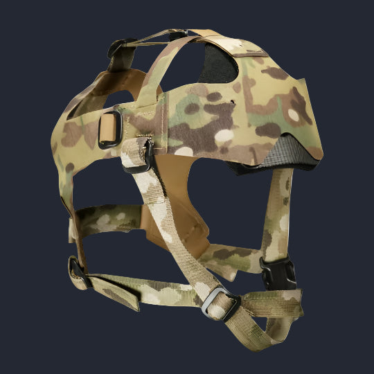 A head-mounted NVG Skull Harness with a camouflage pattern, featuring adjustable straps and a metal NVG Shroud.