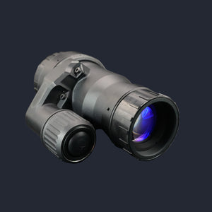 Black Monocular with blue lens on a reflective surface